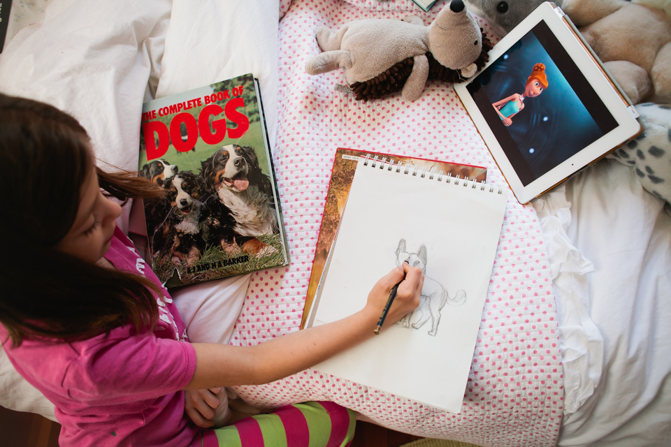 child drawing in sketchbook - Documentary Family Photography