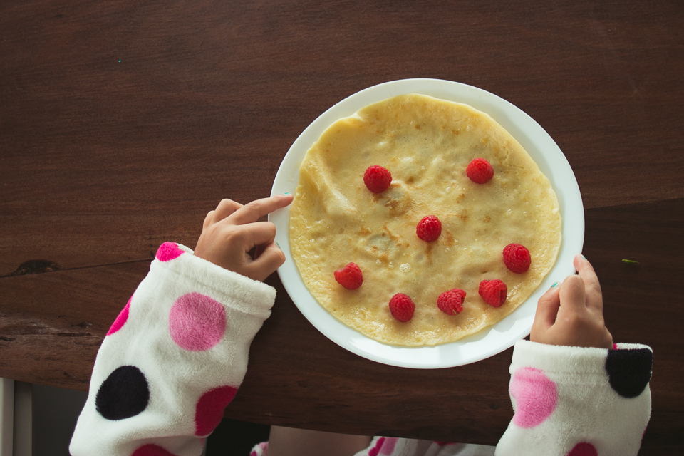 girl with happy pancake - Documentary Family Photography