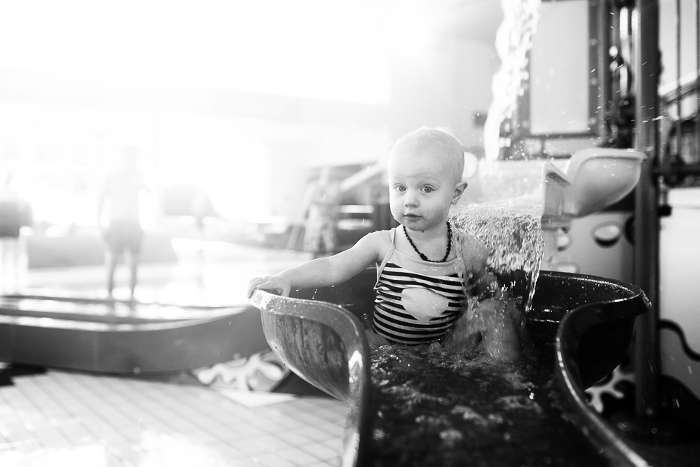 baby in splash pad - Documentary Family Photography