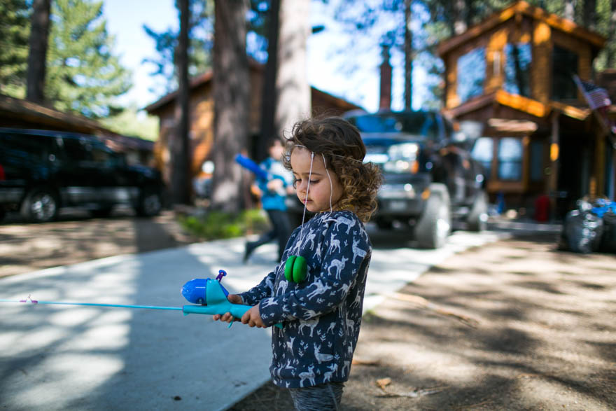 girl with fishing pole - Documentary Family Photography