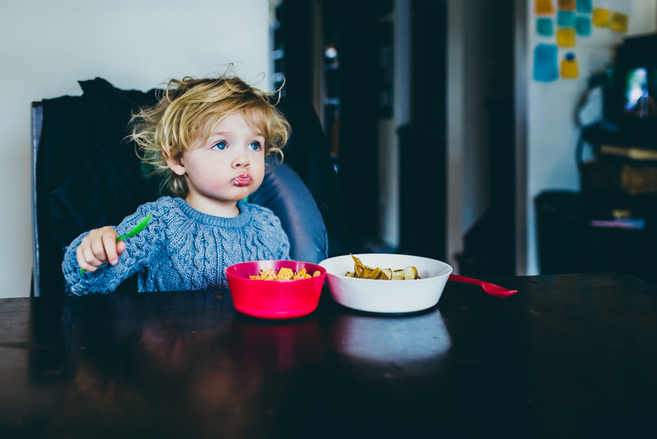 child with bed head and cereal - Documentary Family Photography