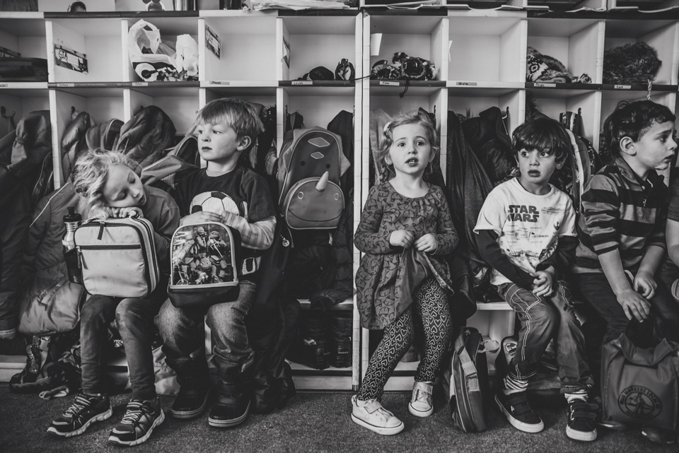 kids waiting in front of cubbies - Documentary Family Photography