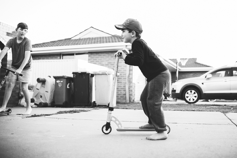 Child on scooter - Documentary Family Photography