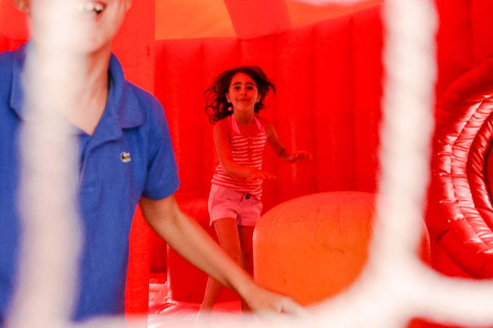 kids in bounce house - Documentary Family Photography