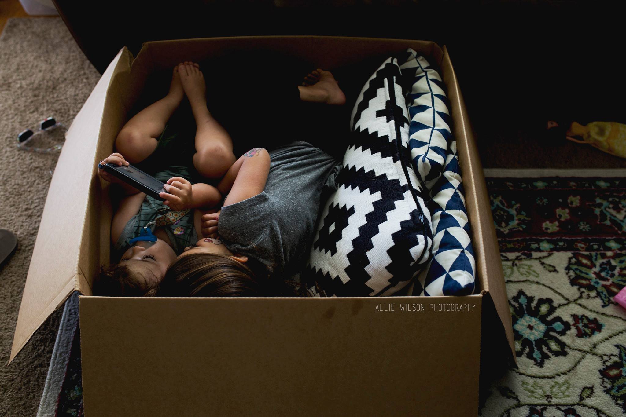 kids cuddled in box - Documentary Family Photography