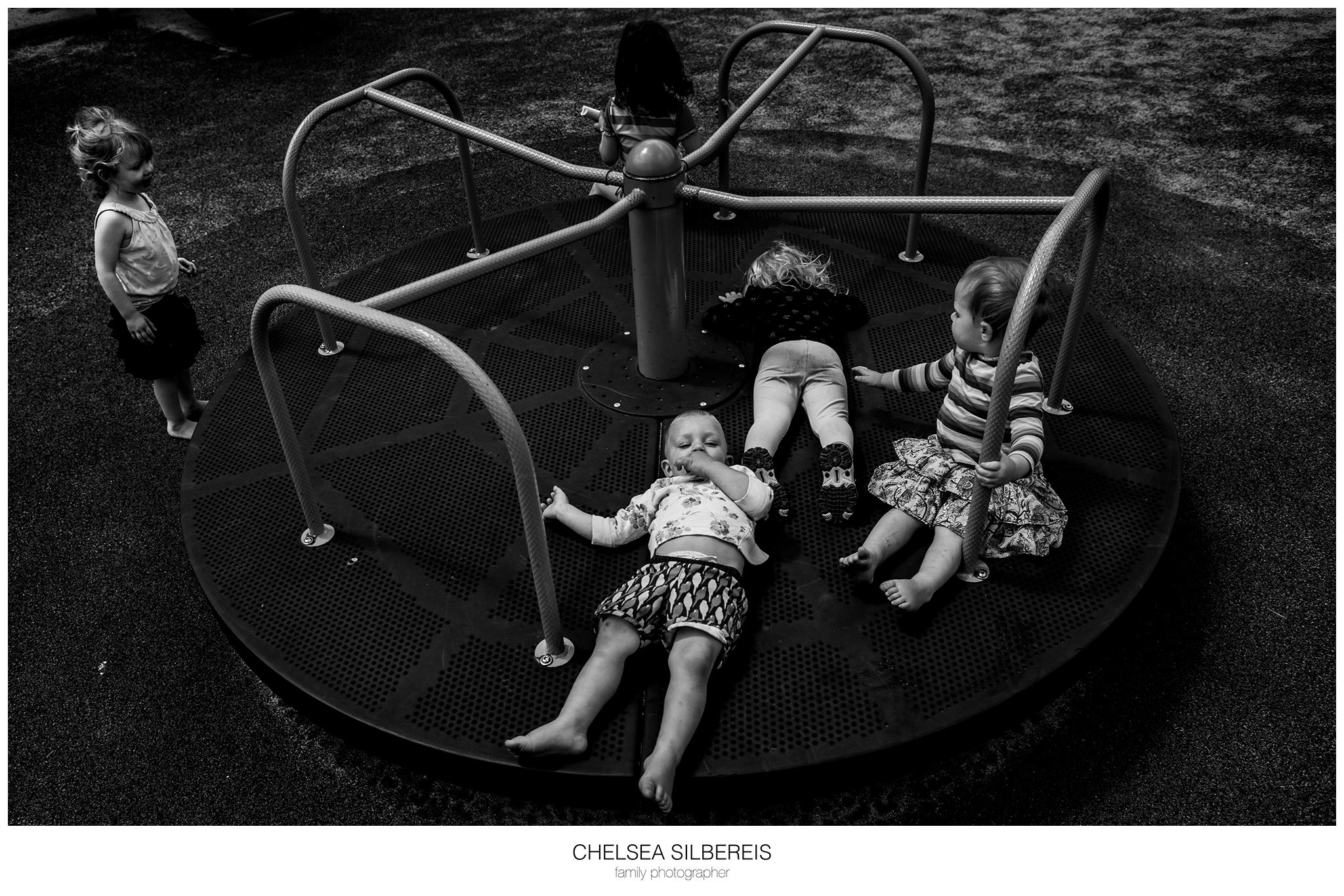 kids on merry go round - Documentary Family Photography