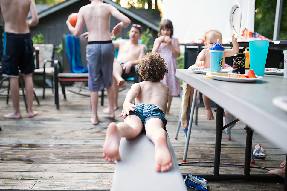 boy lying on picnic bench - Documentary Family Photography