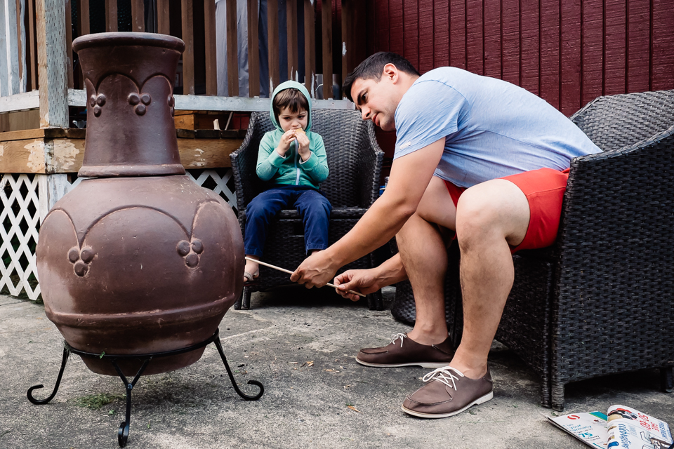 father and son making smores - Documentary Family Photography