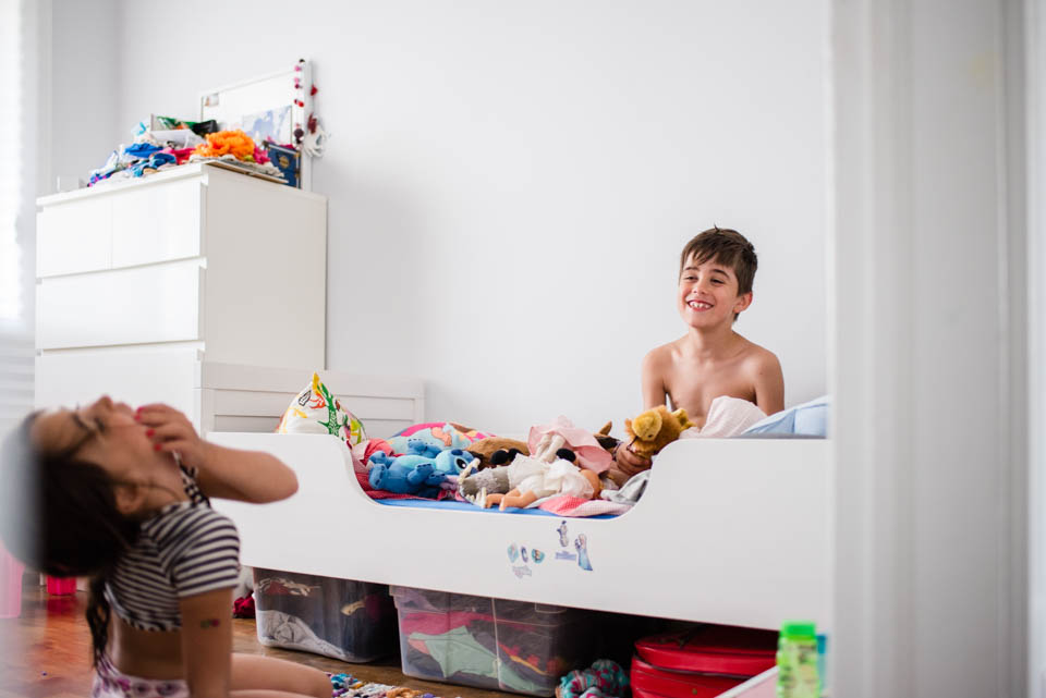 kids laugh in bedroom - Documentary Family Photography