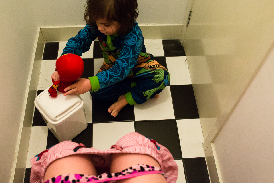 boy plays on bathroom floor - Documentary Family Photography