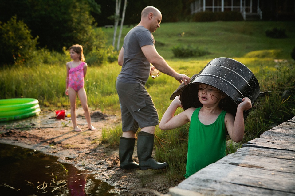 girl with bucket on head - Documentary Family Photography - Sham of the Perfect