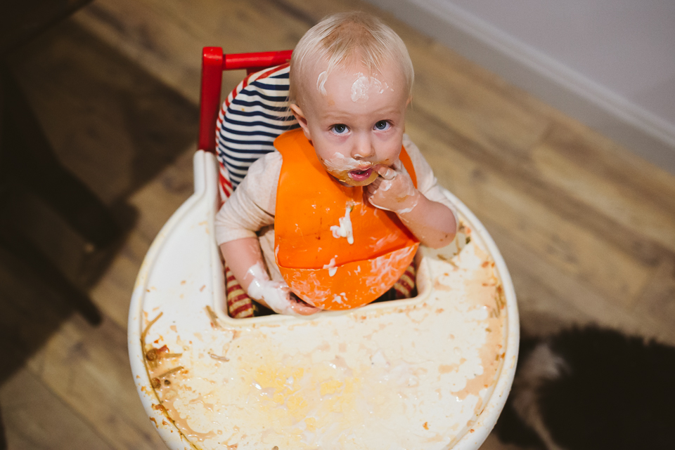 messy baby in high chair - Documentary Family Photography