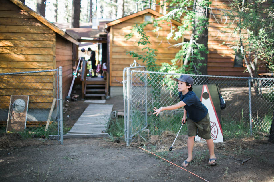 boy plays camp game - Documentary Family Photography