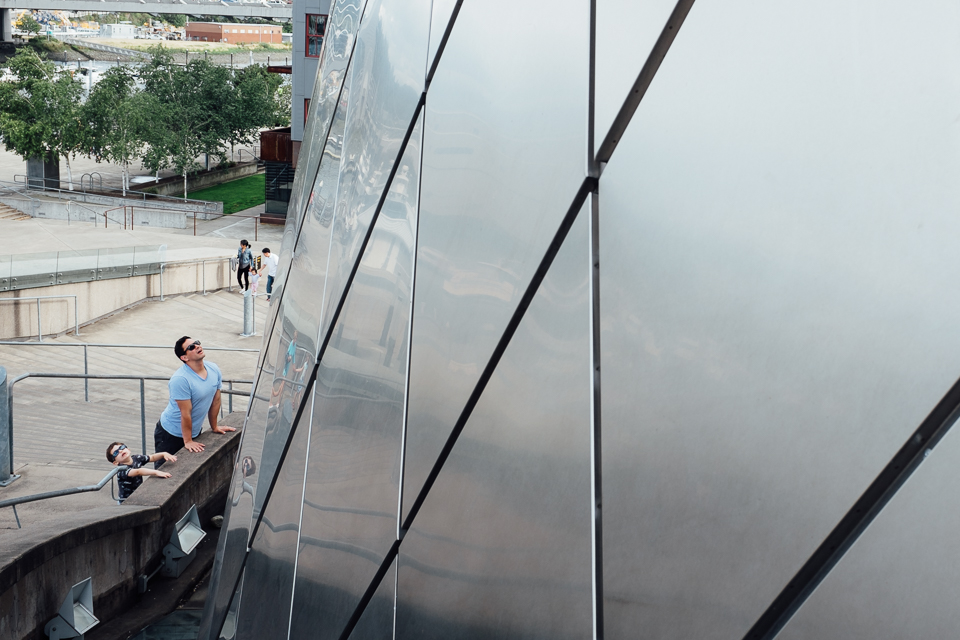 father and son gaze at building - Documentary Family Photography