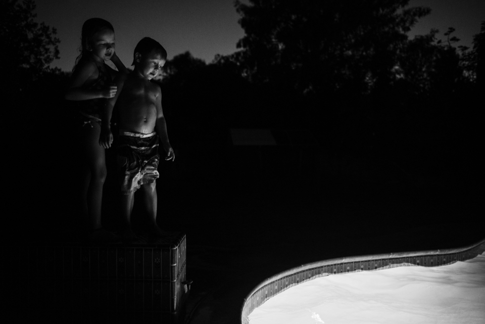 kids near pool at night - Documentary Family Photography