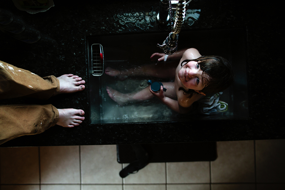 girl takes sink bath