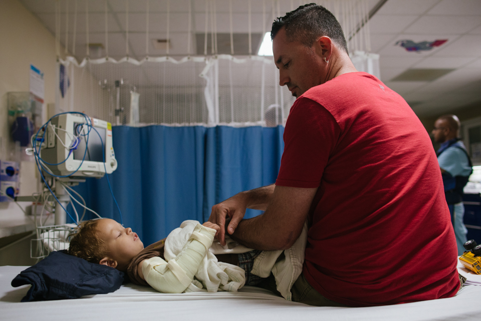 boy at hospital in cast - Documentary Family Photography