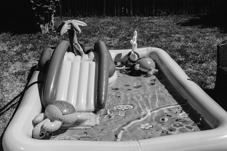 boy falls in kiddie pool - Documentary Family Photography