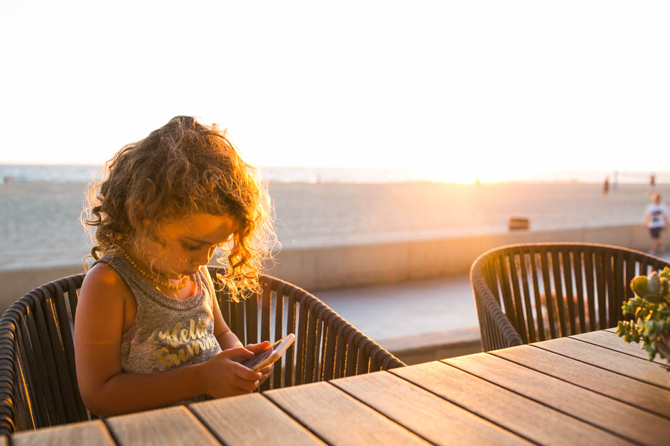 girl on phone - Documentary Family Photography