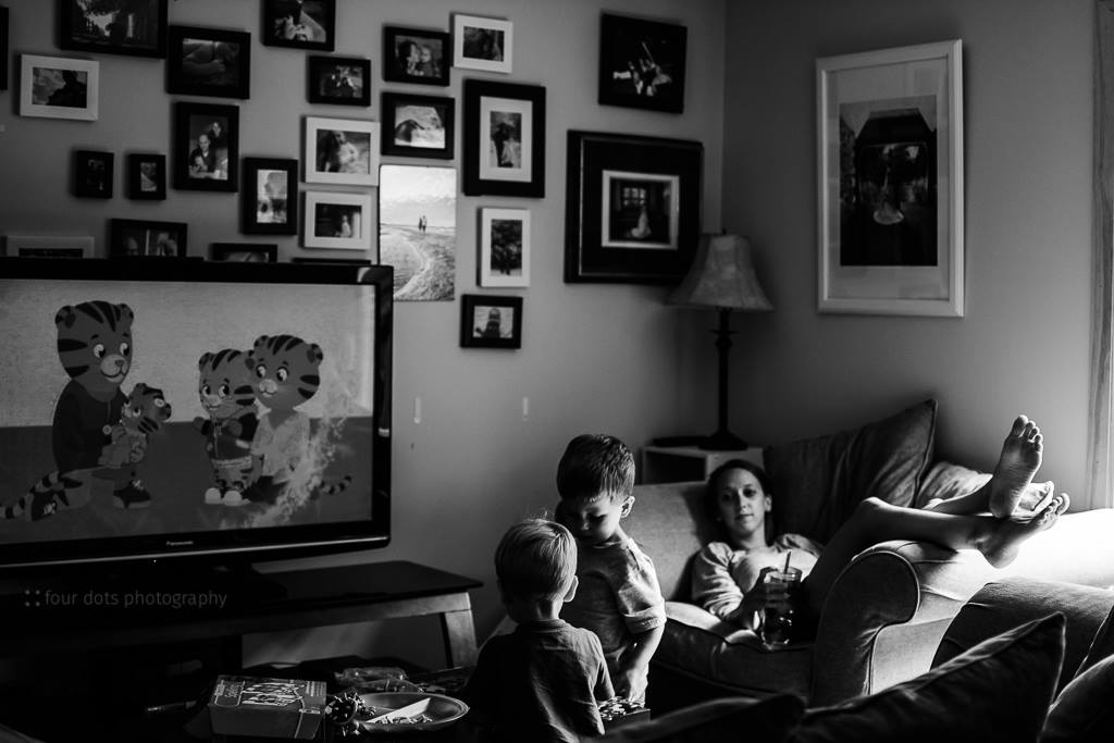 tired mother watches children - Documentary Family Photography