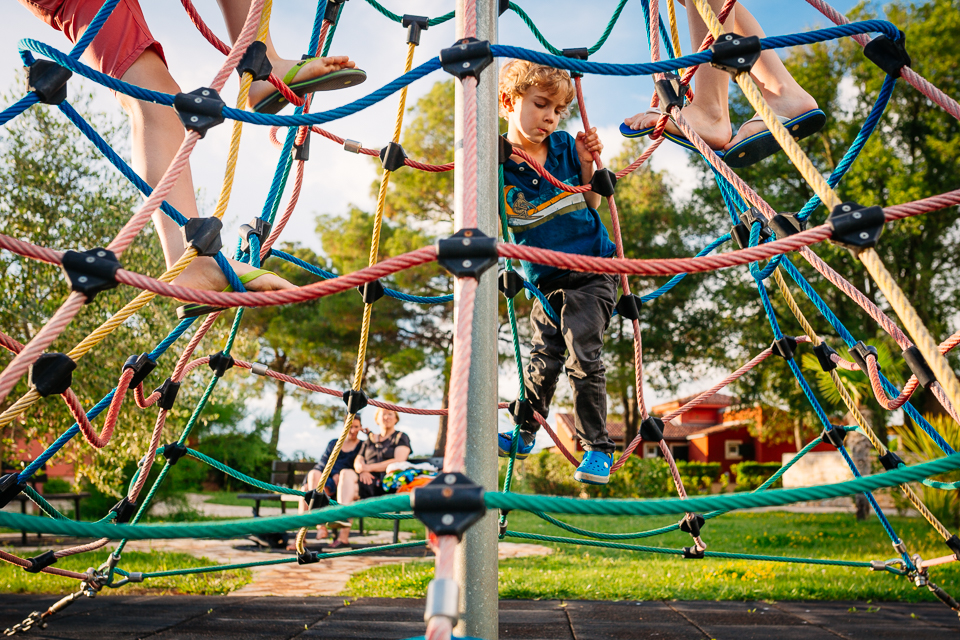 boy on jungle gym - Documentary Family Photography