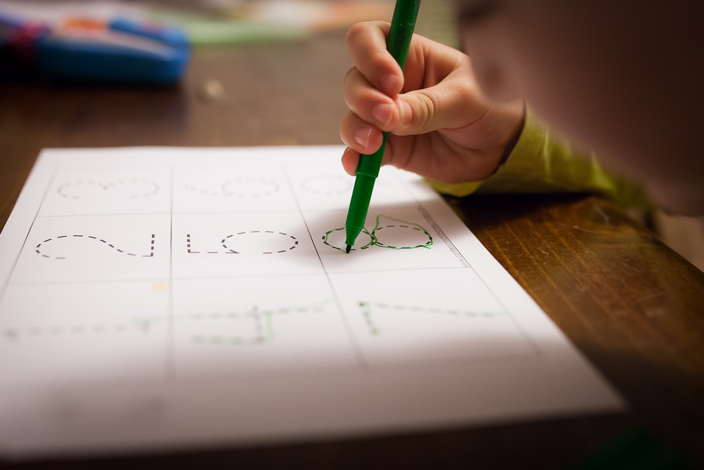 child practicing writing - Documentary Family Photography