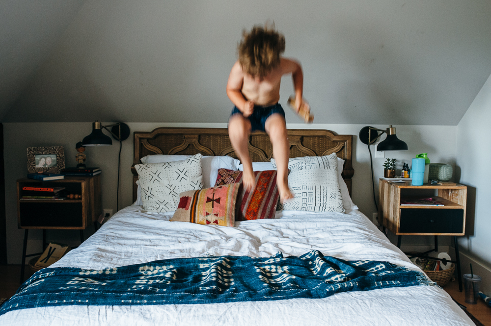 boy jumping on bed - Documentary Family Photography