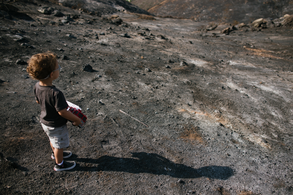 child with truck in dirt field - Documentary Family Photography