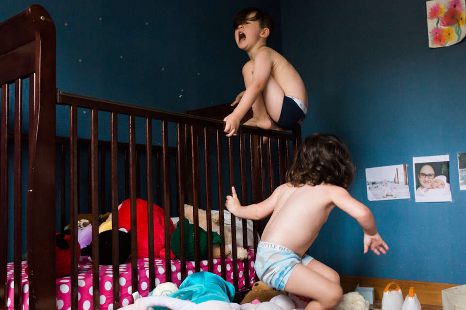 kids climbing on crib - Documentary Family Photography