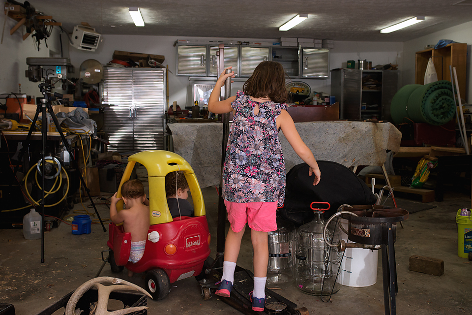 kids playing in garage - Documentary Family Photography