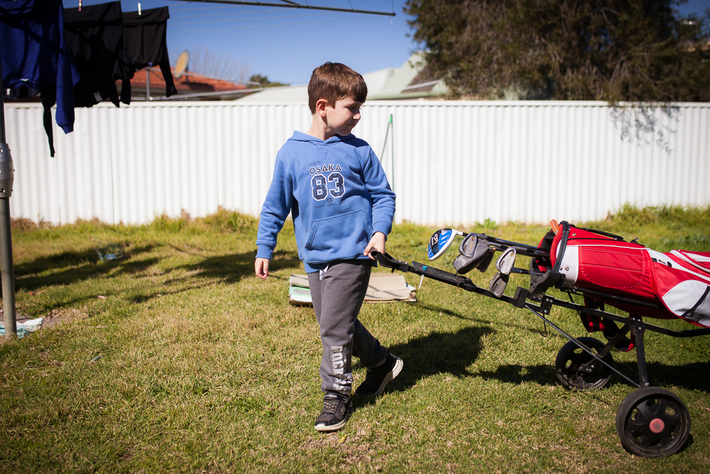 boy in back yard - Documentary Family Photography