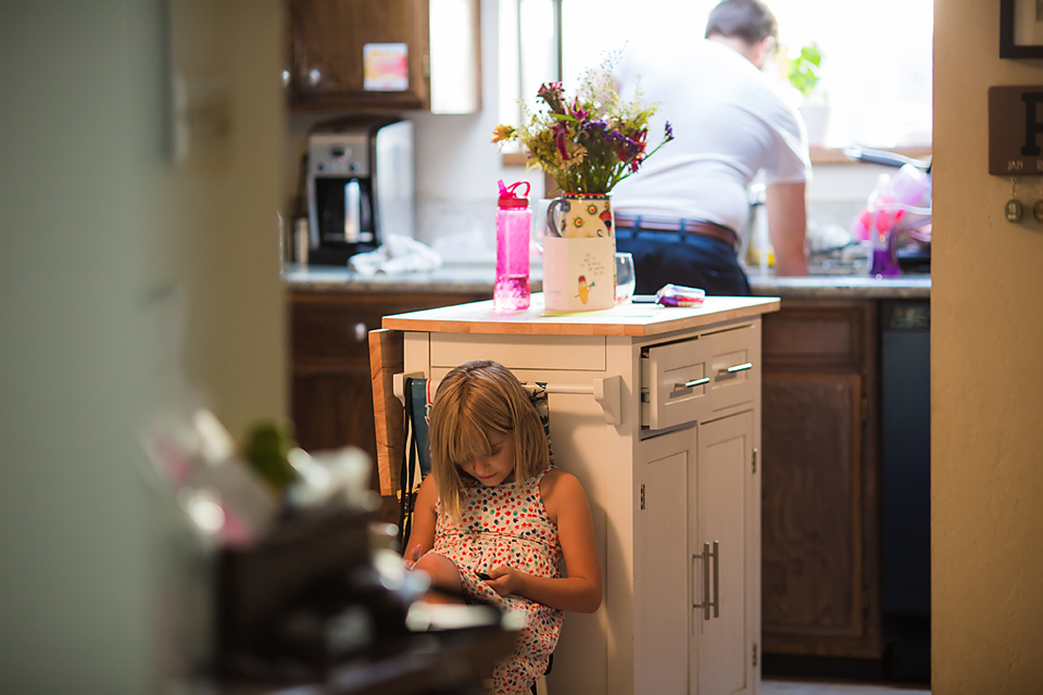 girl studies in kitchen - Documentary Family Photography