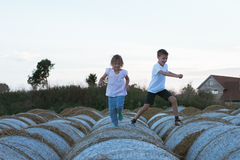 kids on hay bales - Documentary Family Photography
