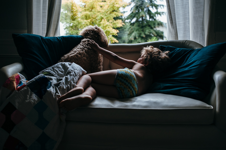 boy and dog on couch - Documentary Family Photography