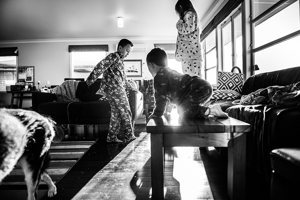 kids climbing on furniture in pajamas