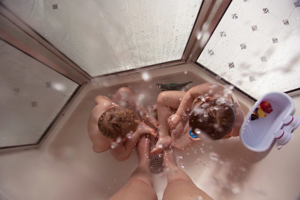 kids on shower floor - Documentary Family Photography