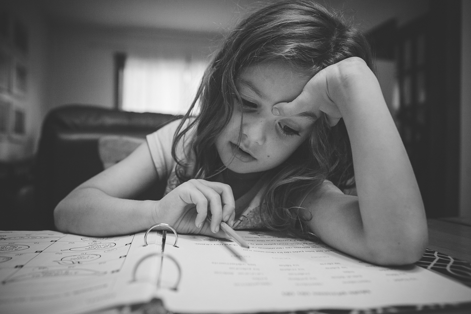 girl does homework - Documentary Family Photography
