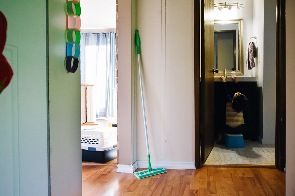 Boy goofs off in bathroom - Documentary Family Photography