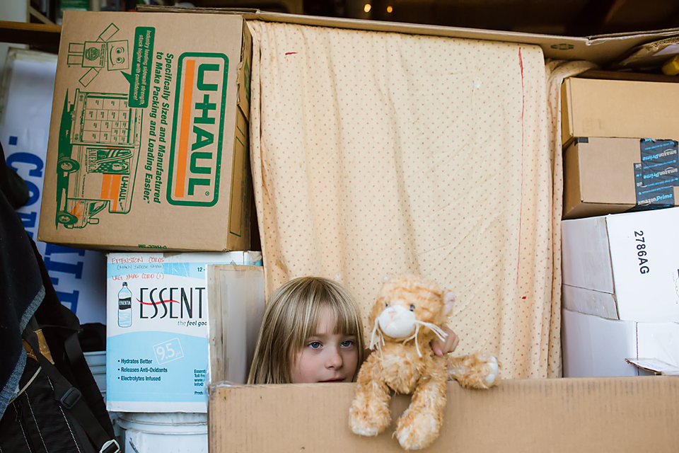 girl in box fort with stuffed animal - Documentary Family Photography