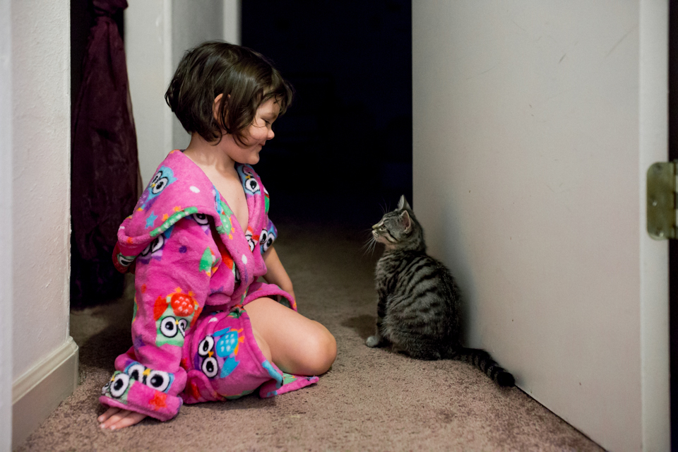 girl in bathrobe with Kitten - Documentary Family Photography