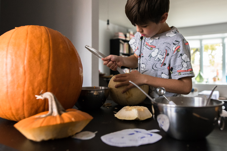 boy carving pumpkin - Documentary Family Photography