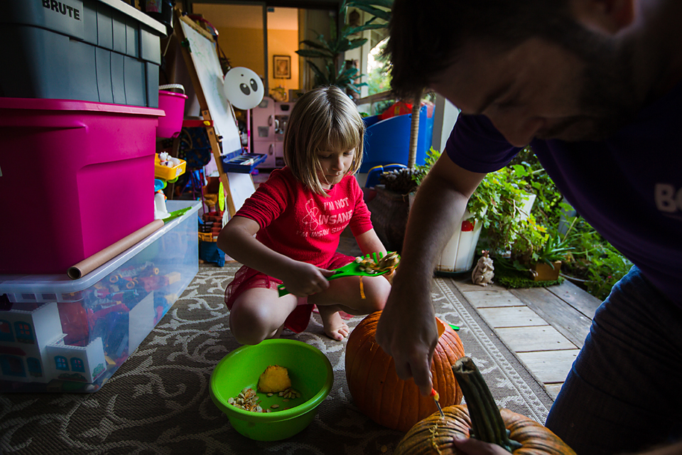 girl and father carve pumpkin - Documentary Family Photography