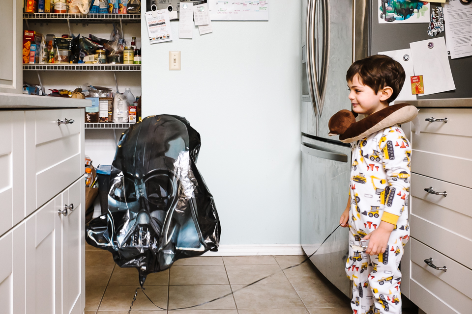 boy with star wars balloon - Documentary Family Photography