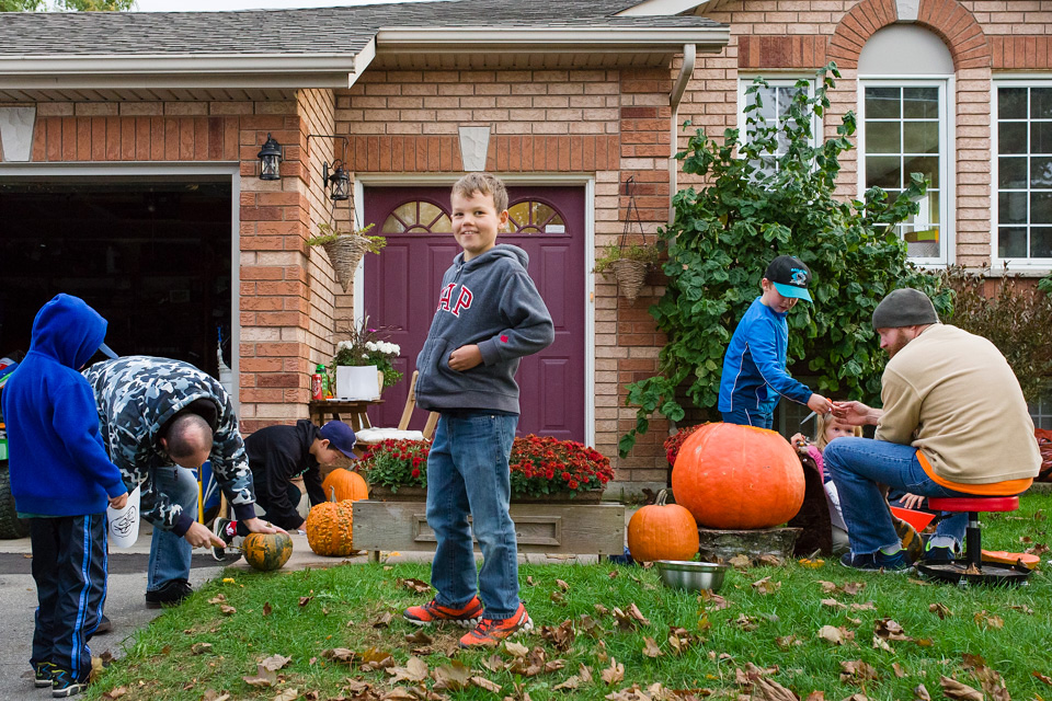 kids outside with pumpkins - Documentary Family Photography