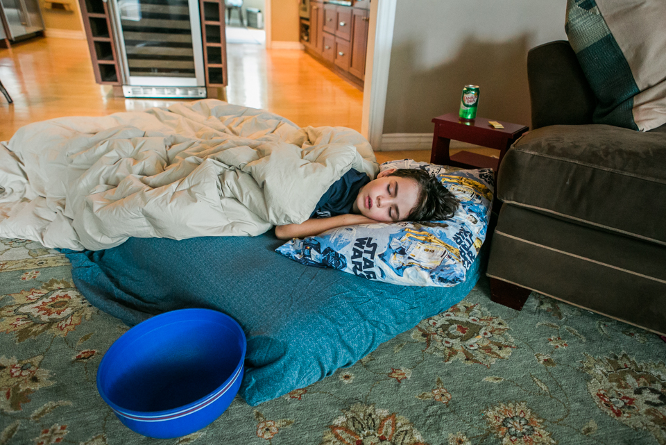 sick boy asleep on floor -Documentary Family Photography