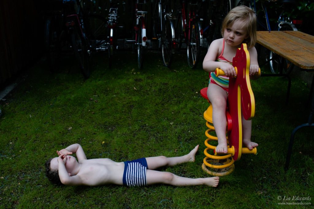 kids in swimsuits on out door play equipment - Documentary Family Photography