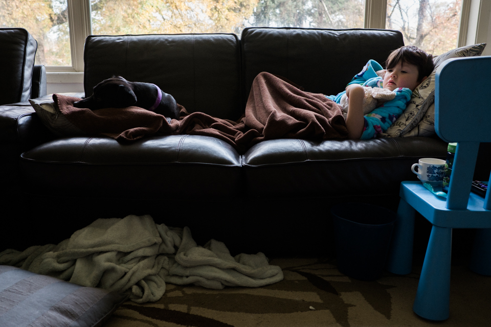 sick kids on couch - Documentary Family Photography