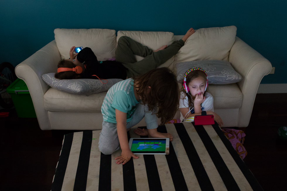 kids with electronics in living room - Documentary Family Photography