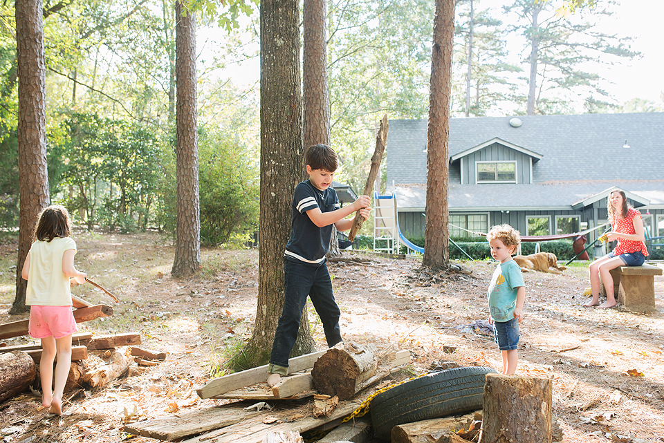 kids playing with logs - Documentary Family Photography