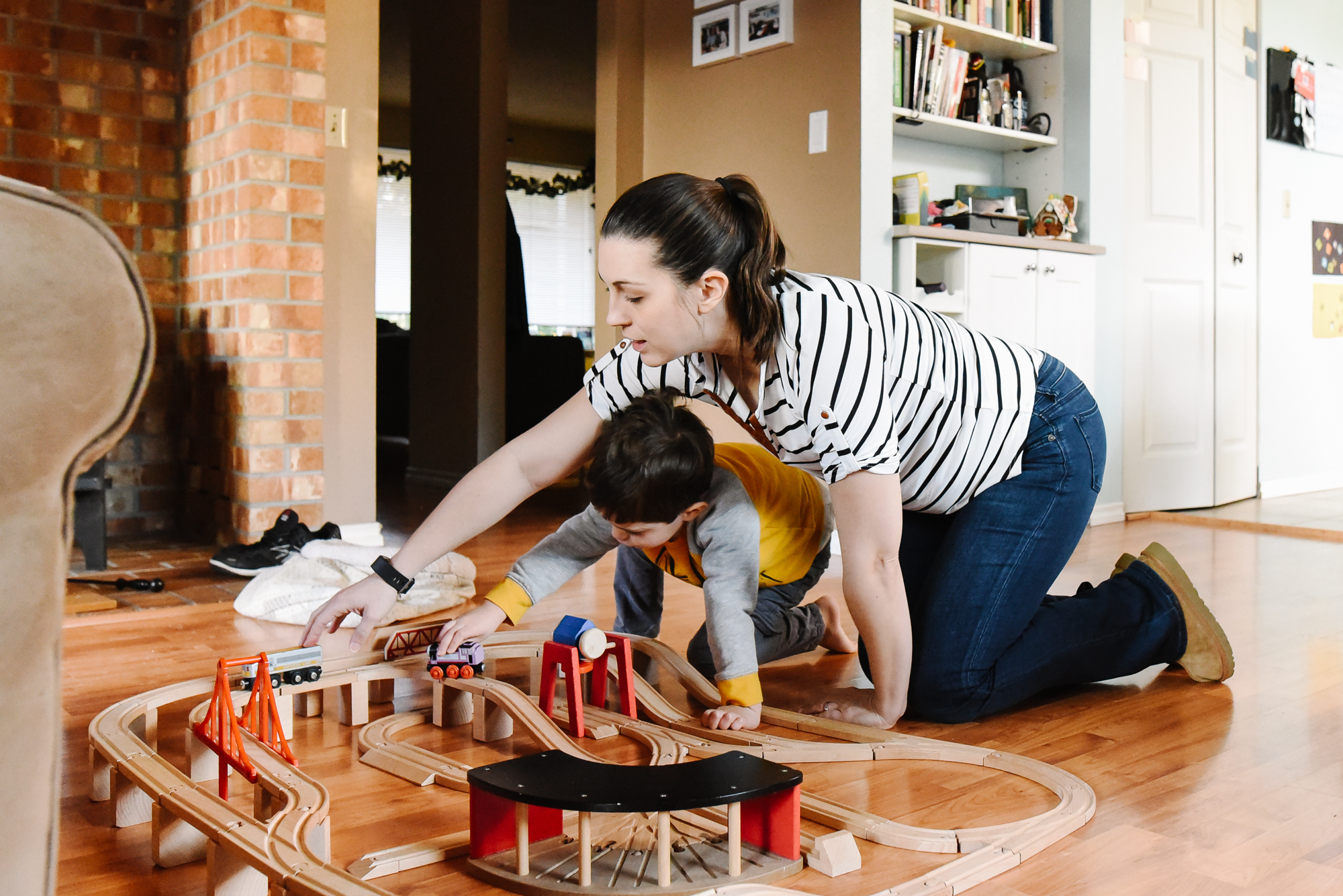 mother and son play trains